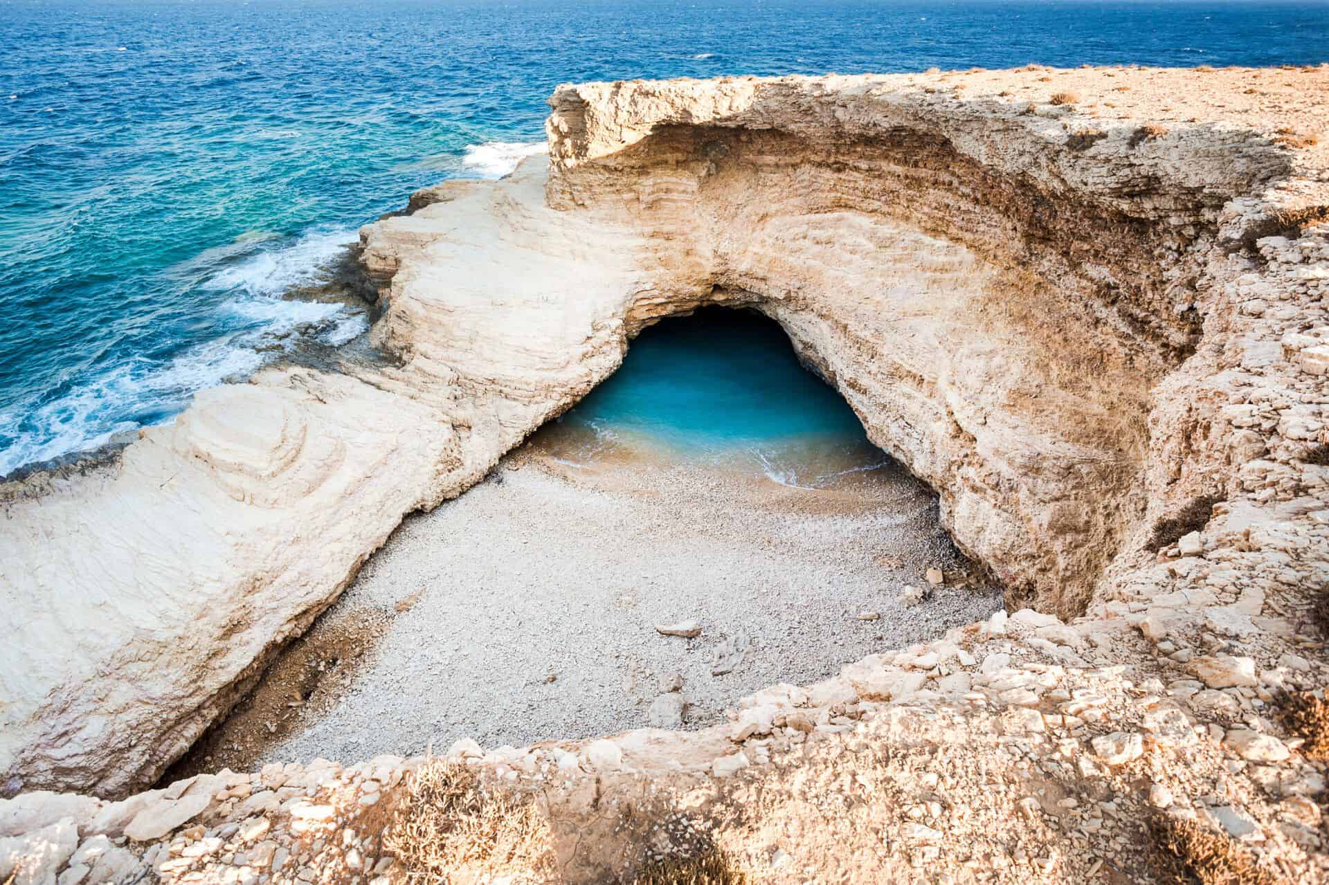 Gala Beach in Koufonisia — secluded rocky cove with clear blue waters