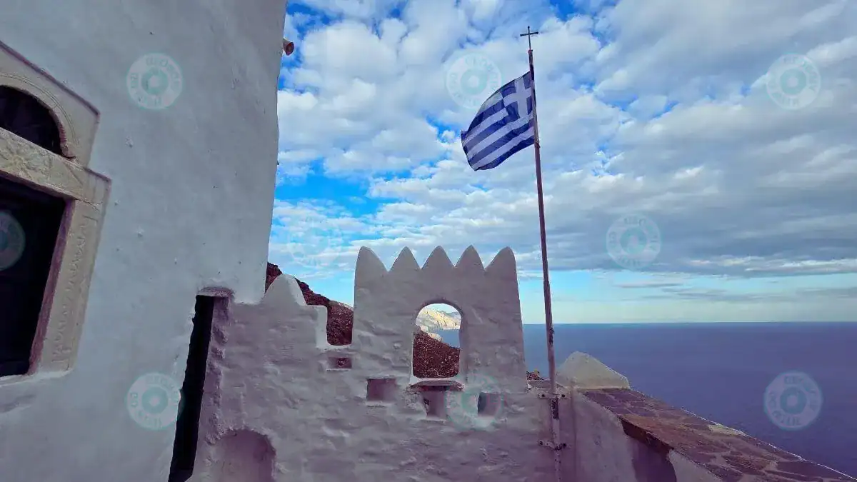 Built window with Greek flag and Aegean view